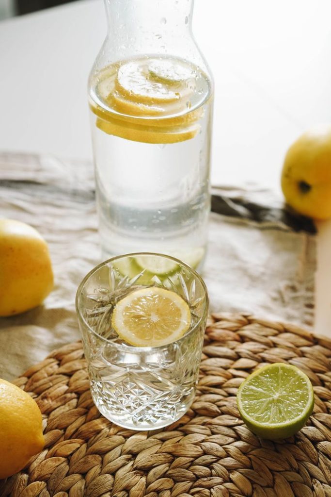 A refreshing glass of water infused with lemon and lime, perfect for a summer day.